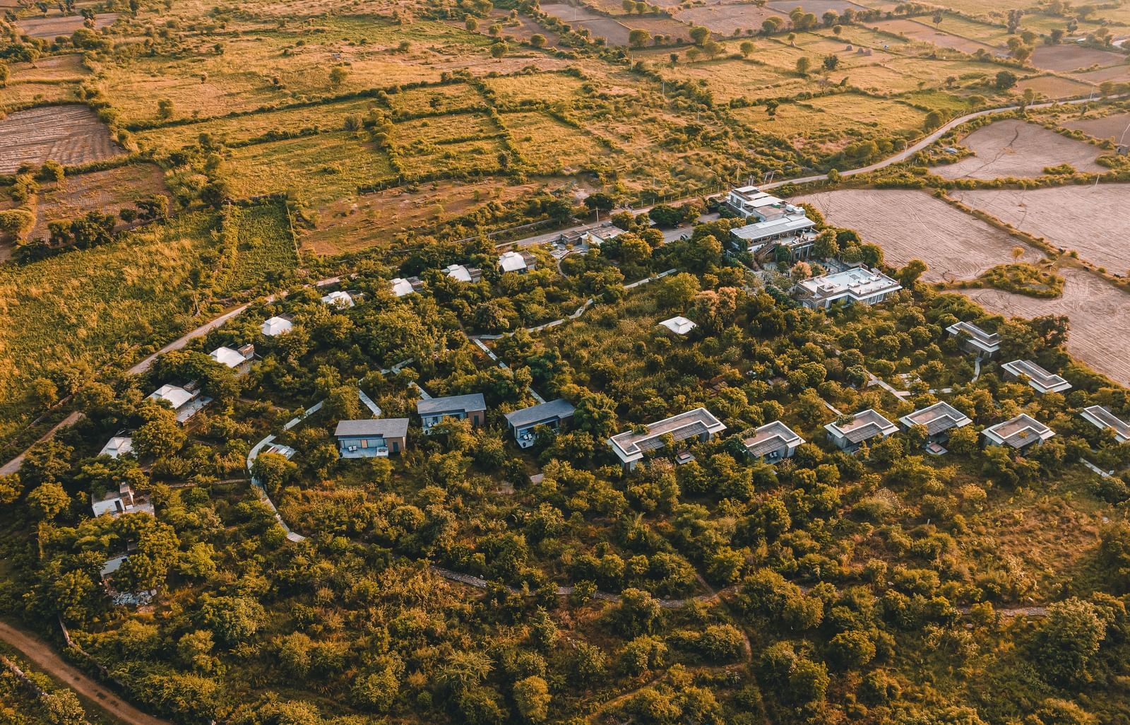 An aerial image of the Utsav Camp Sariska showcasing the hotel and greenery around it