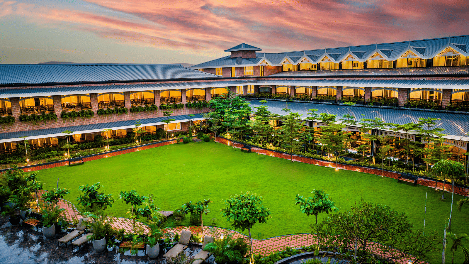 Panoramic exterior view of MAYFAIR Oasis Resort and Convention at dusk Jharsuguda