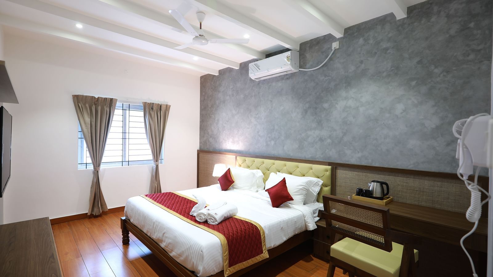 Full view of the Standard Room featuring a double bed with ample of natural light coming from the window beside it at WOW Naturefull Resorts, Yercaud.