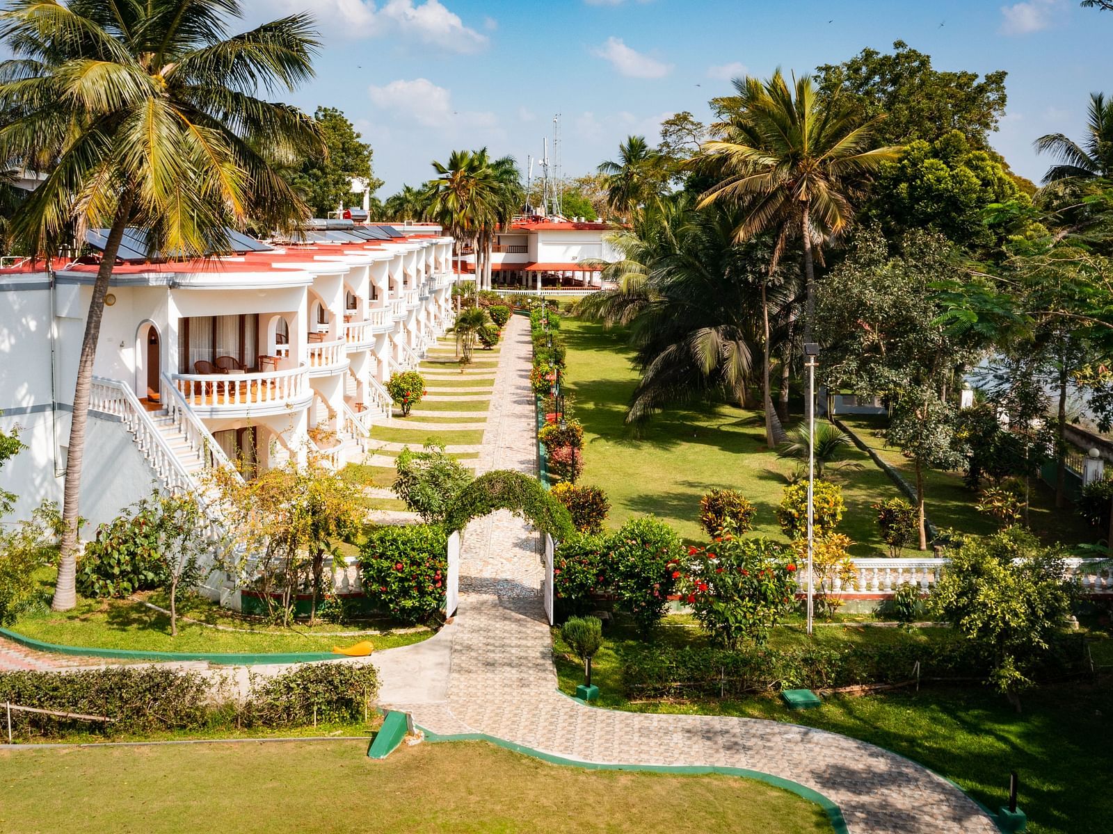 Aerial shot of the hotel surrounded by lush greenery - GReaT Trails River View Resort Thanjavur By GRT Hotels
