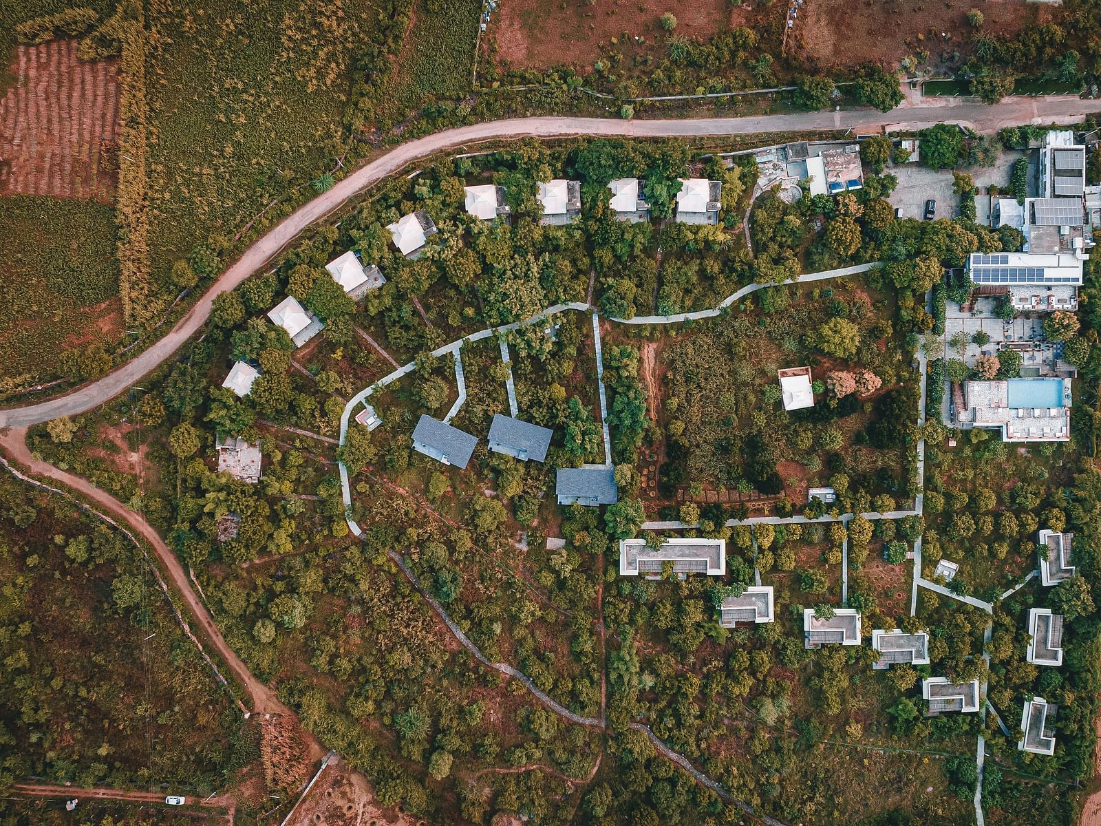 An aerial image of the Utsav Camp Sariska showcasing the hotel and greenery around it