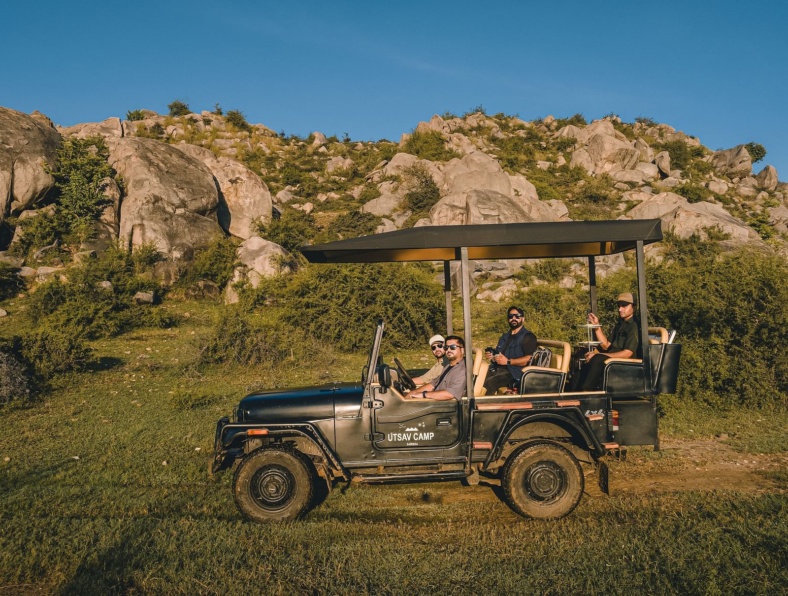A group of people on a safari jeep - Utsav Camp