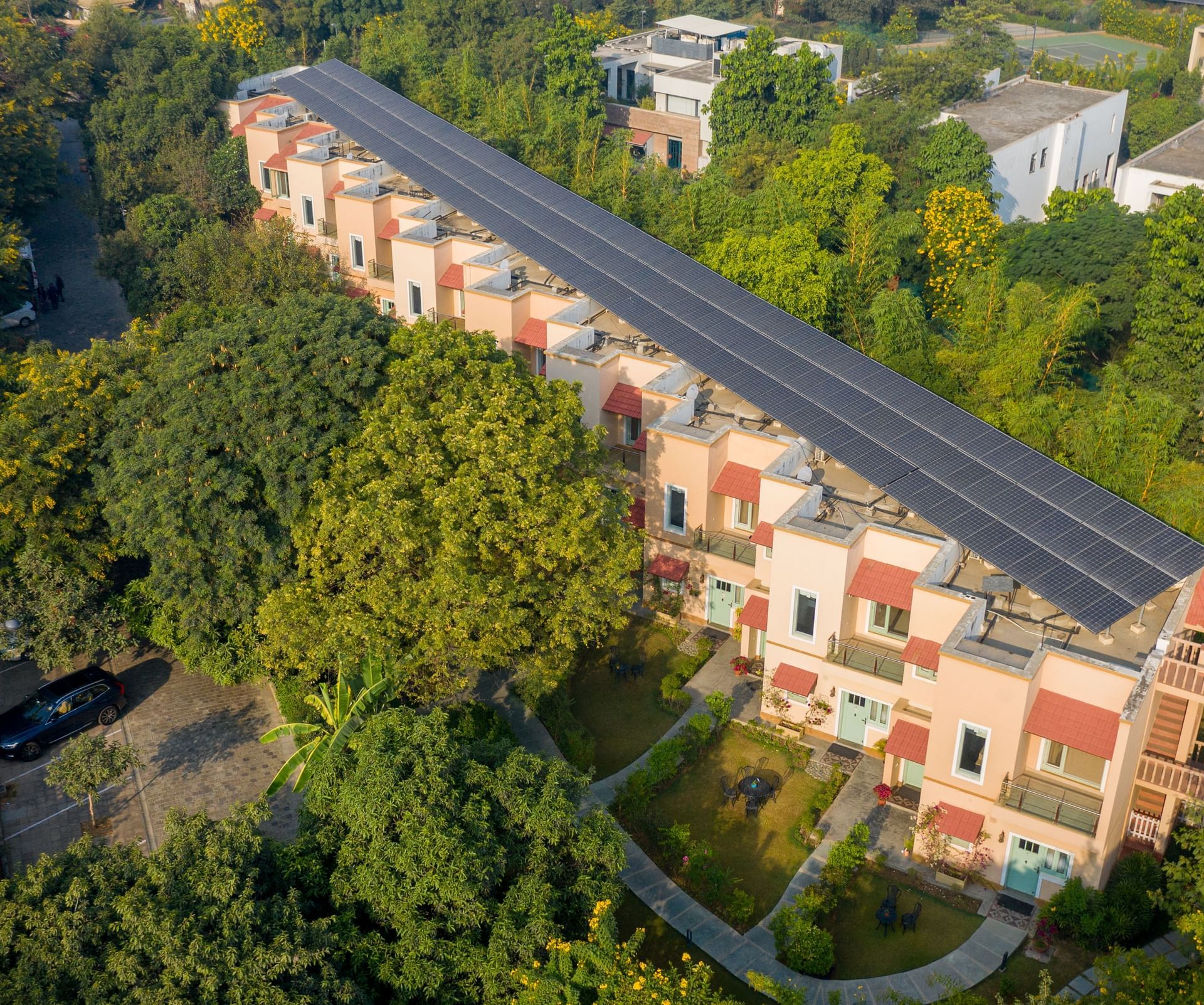 Aerial view of Karma Chalets surrounded by lush greenery.
