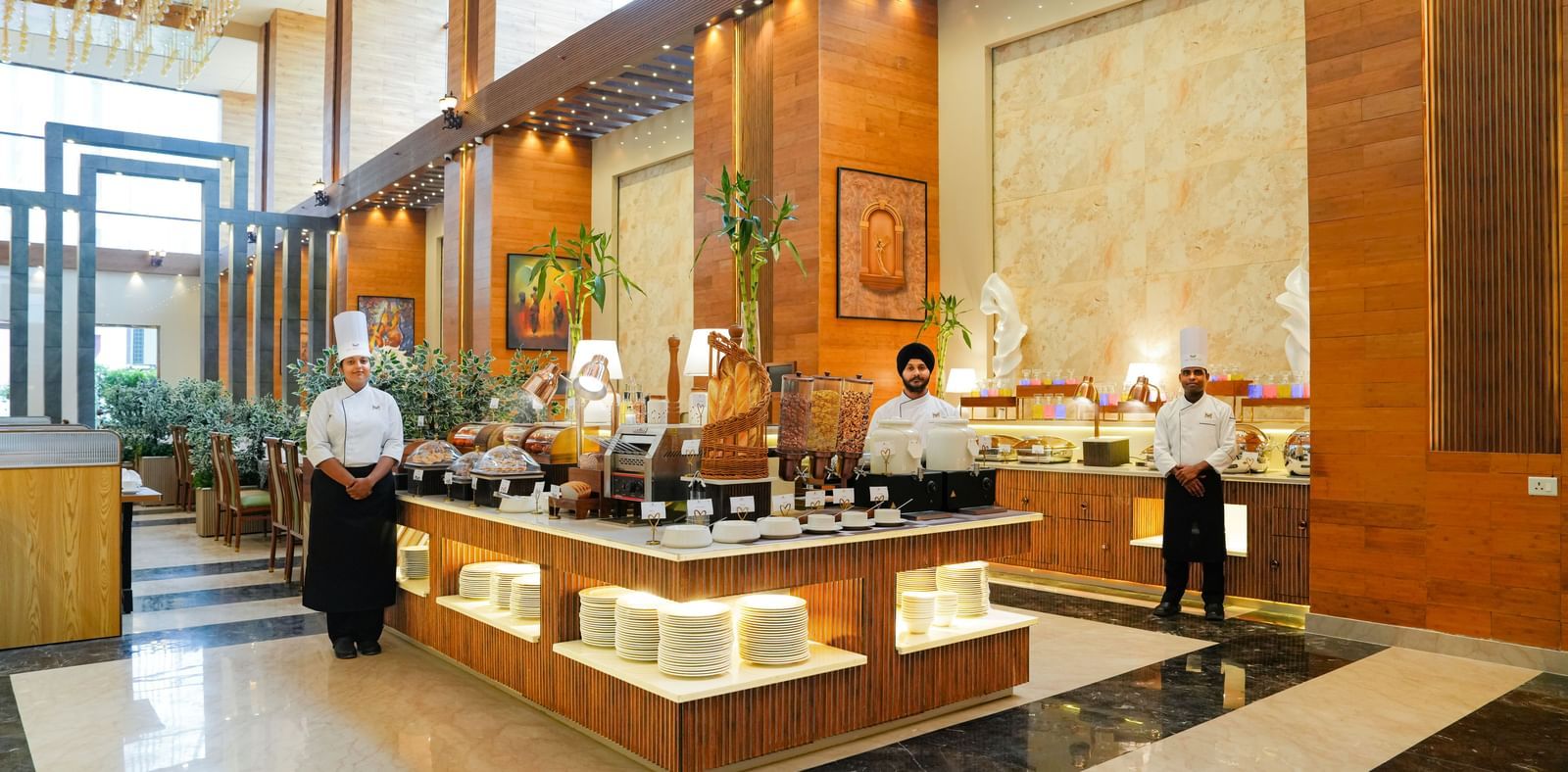 Dining at The Meriton Hotels with bright lighting and elegant structures.