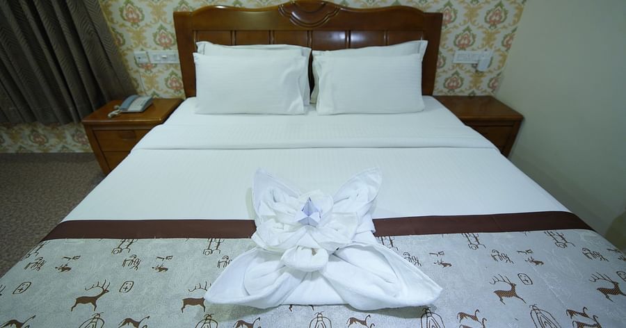 Close up view of the double bed in the Themed Villa of GK Hill View Resort.