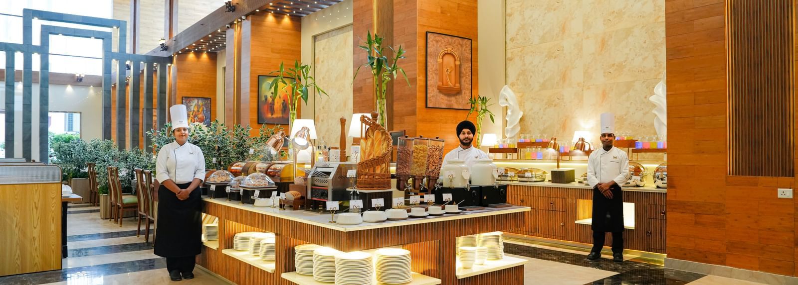 Dining at The Meriton Hotels with bright lighting and elegant structures.