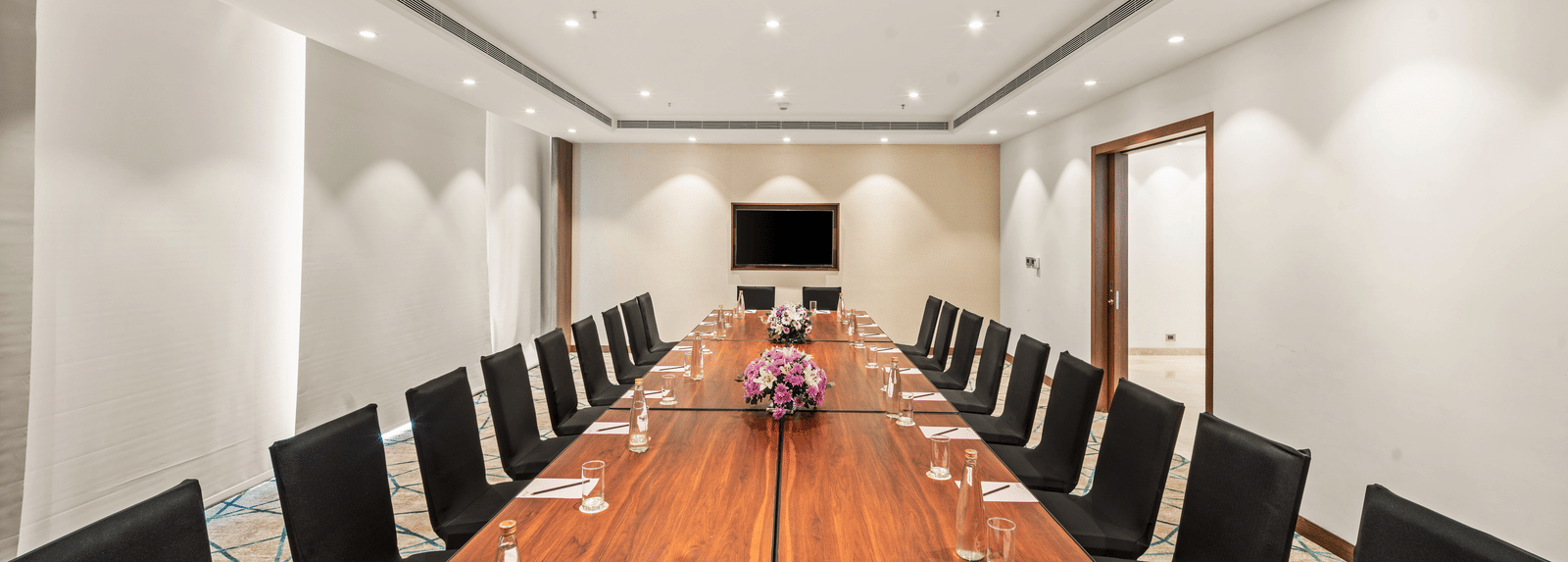 An image of a boardroom of Grand Club Lounge at Grand Vijayawada by GRT Hotels.
