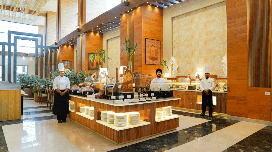 The best dining in Delhi at The Meriton Hotel with bright lighting and elegant structures.