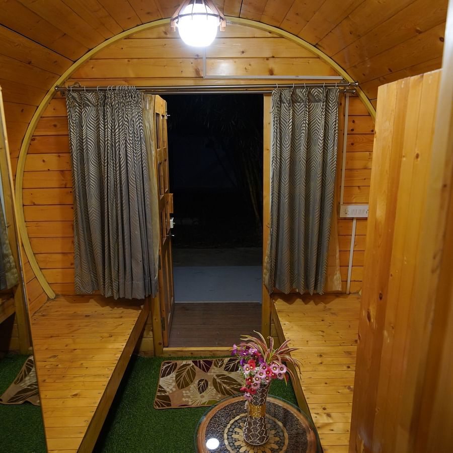 Door leading the way out from the round-shaped Wooden House at GK Hill View Resort.