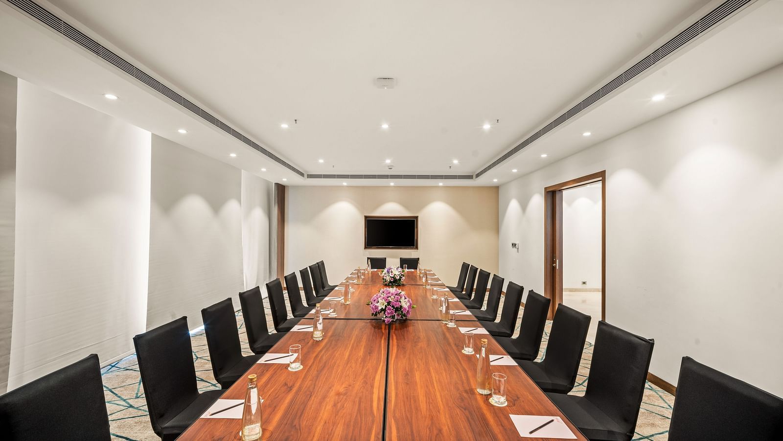An image of a boardroom of Grand Club Lounge at Grand Vijayawada by GRT Hotels.