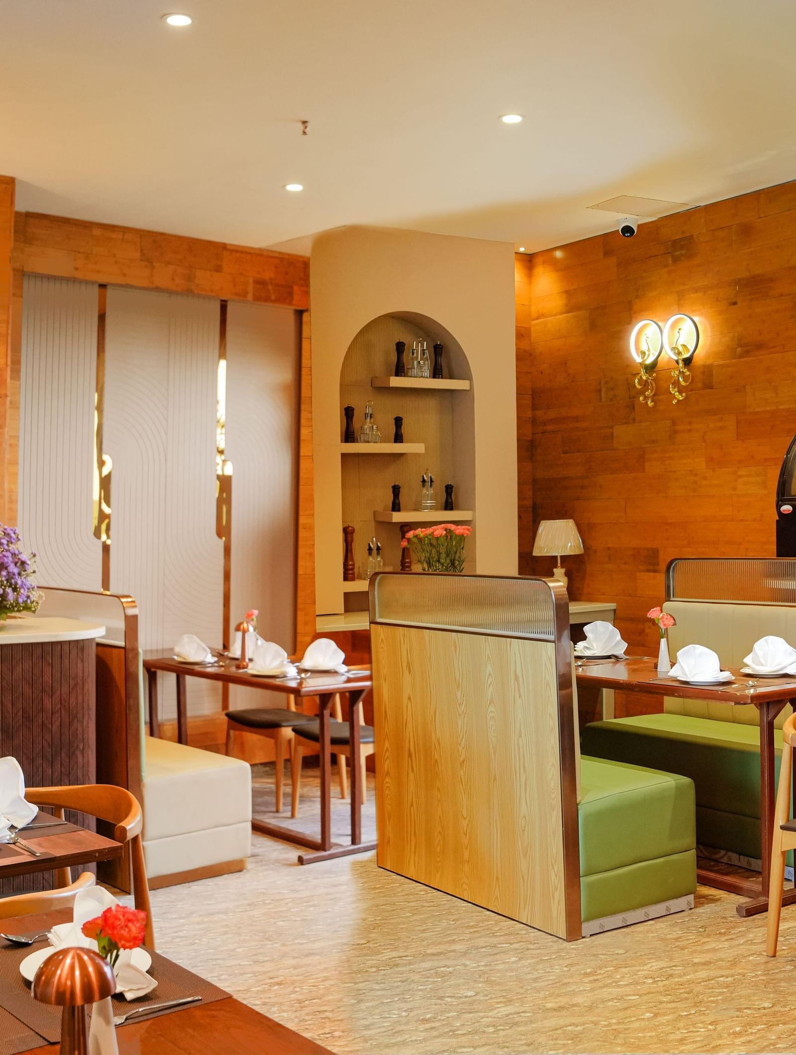 Corner view of the Lotus Cafe featuring a cosy ambience with well arranged dining tables at The Meriton.