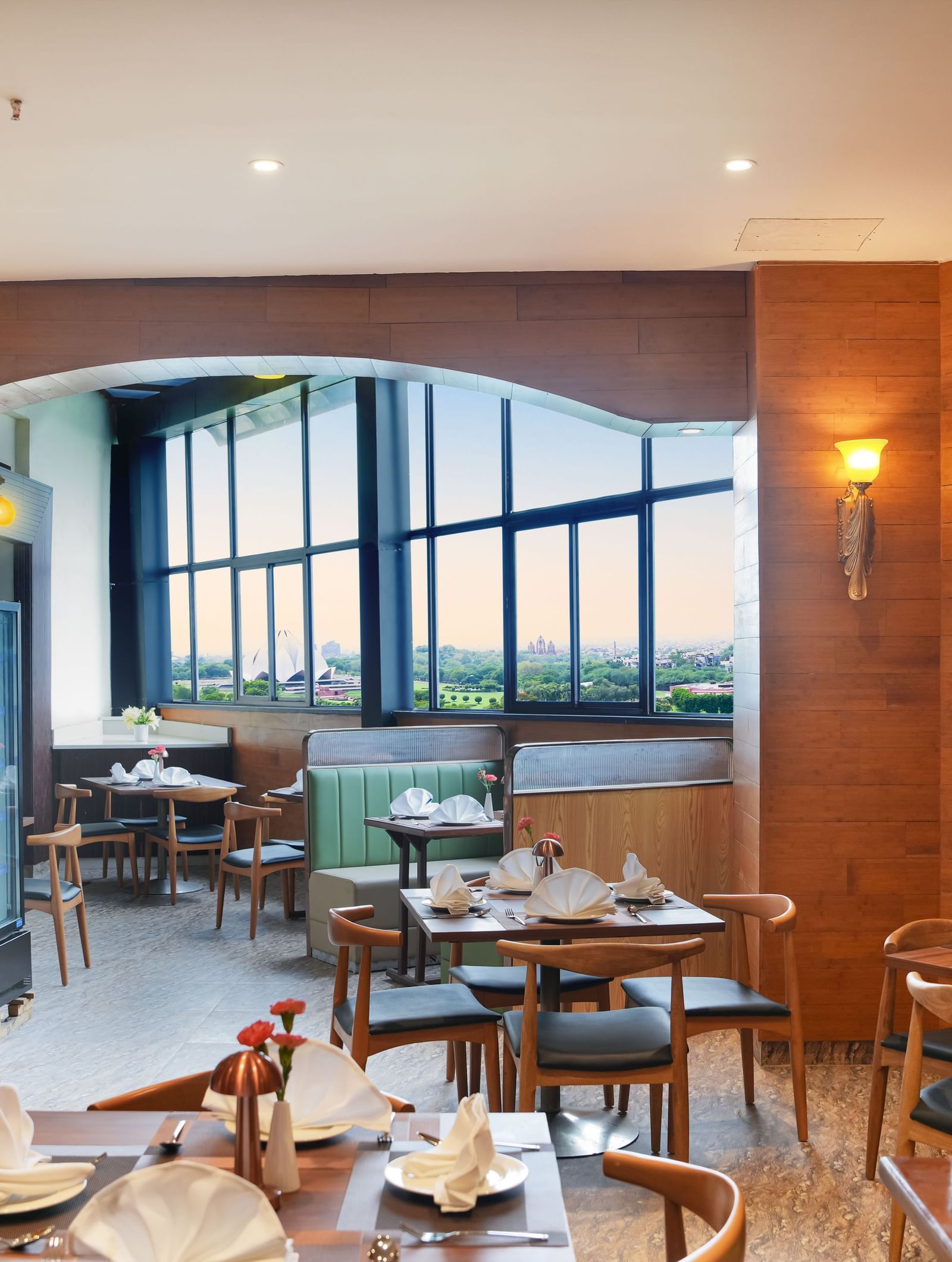 Full view of the Lotus Cafe at The Meriton featuring elegant interiors along with ample of natural light coming from the windows at the far end.