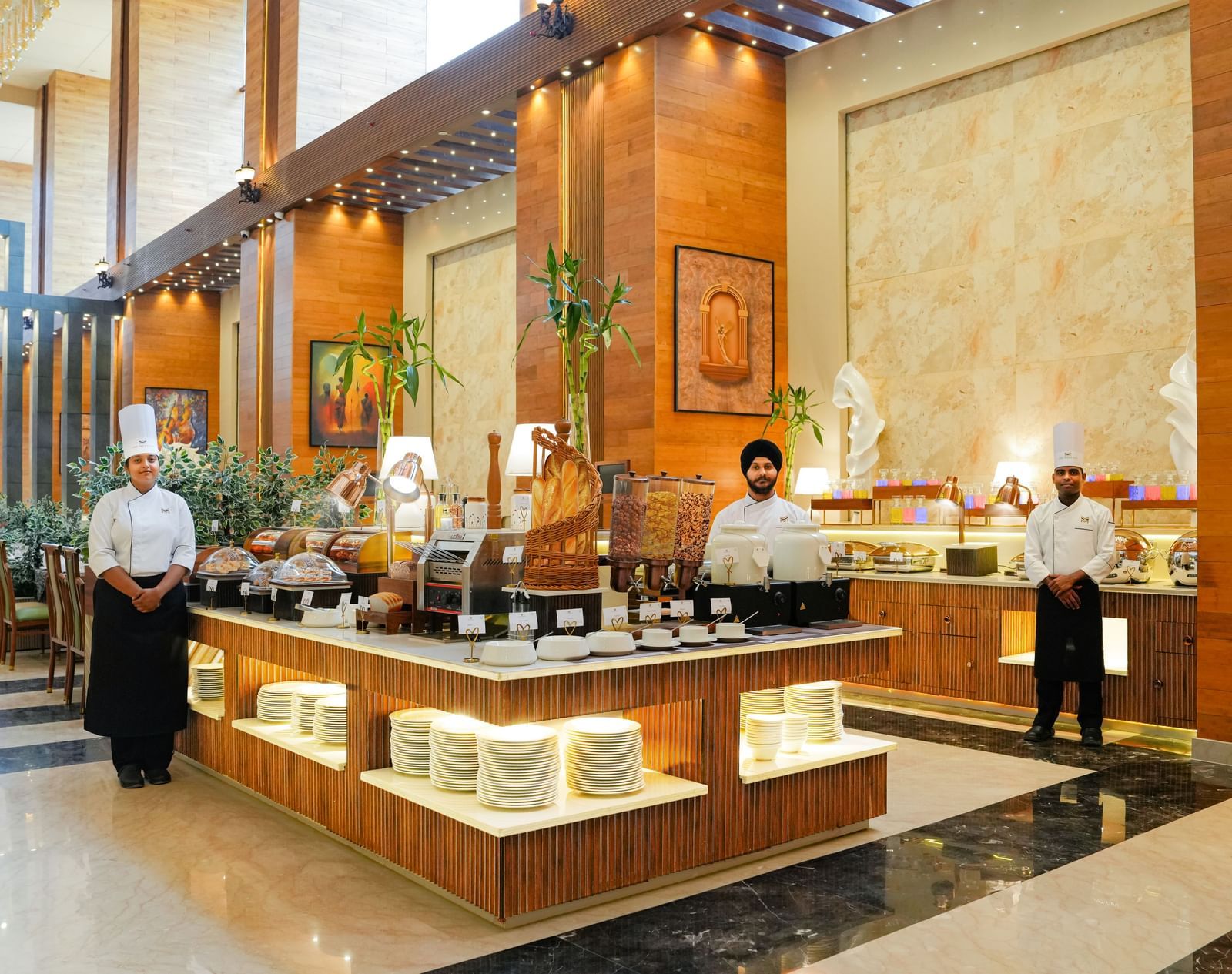 Dining at The Meriton Hotels with bright lighting and elegant structures.