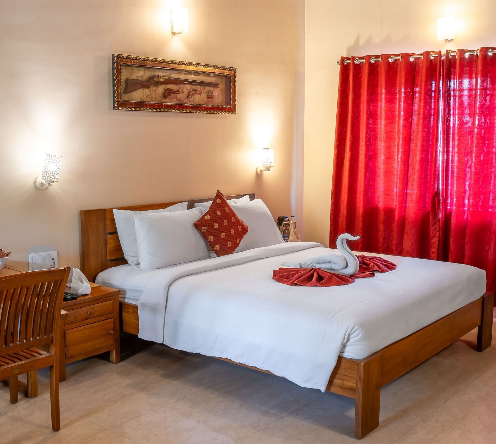 Attic Villa presented with a neatly made bed, red curtains, and minimal decor | Woodstock Resorts, Coorg
