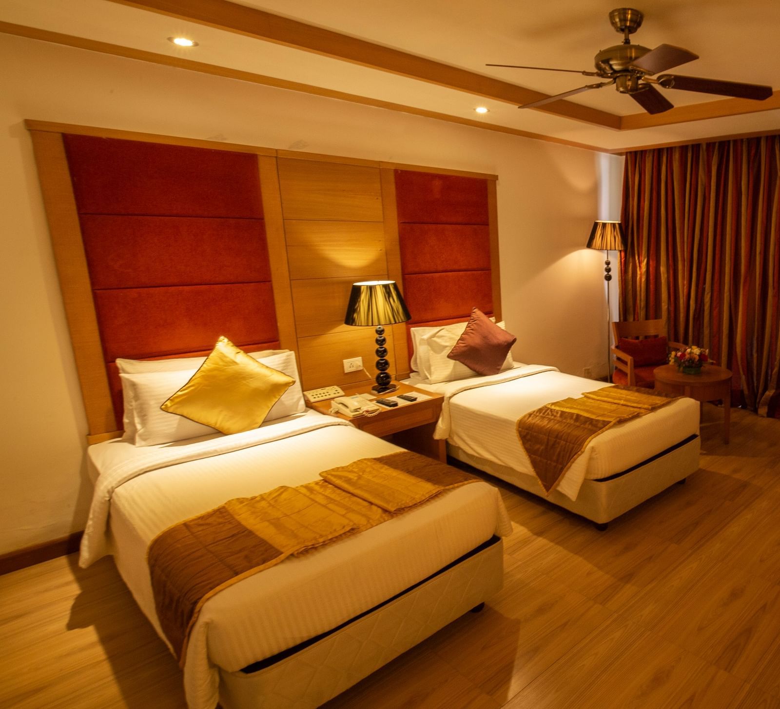 OS-FERNS room with twin beds and a TV at Ocean Spray Puducherry 
