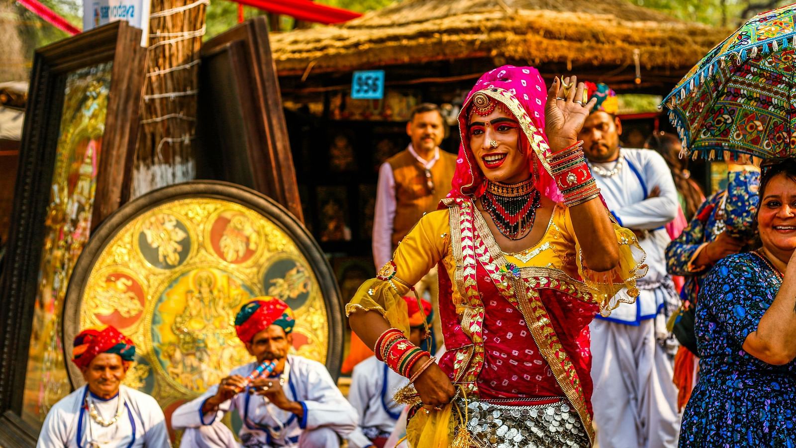 An image of a group of folk artist of Rajasthan in their traditional attire ready for a performance