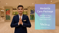 A creative banner featuring a hotel staff inviting guest for Medanta Care Package offer 20 percent off on room rates, free breakfast, and flexible check-in.