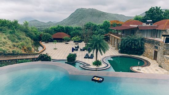 Customised swimming pool with Palm canopy at The Ananta Udaipur