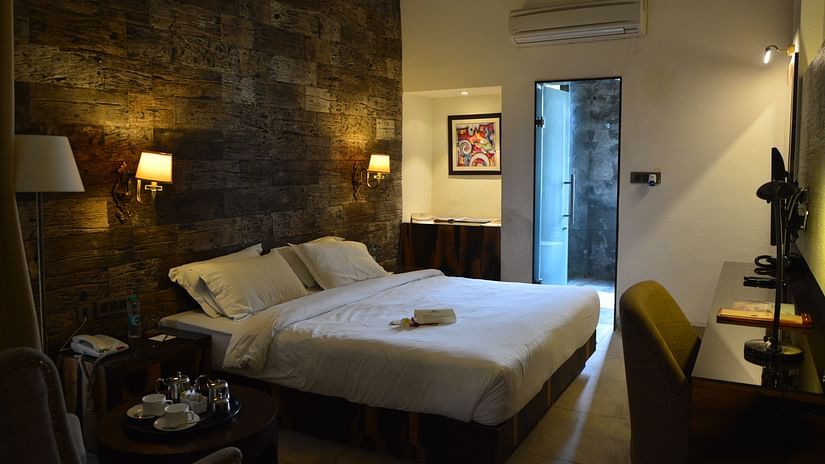 plush bed in cosy dim lighting 