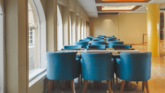 An image of seating area with sofa sets and a centre table placed in a room -  The Garden Ananta Elite, Rajkot