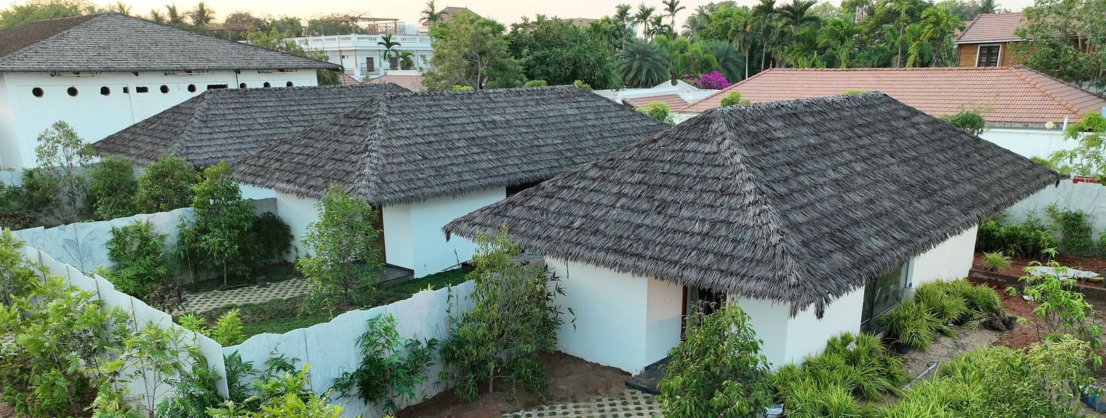 Bird eye view of the individual villas of the Pool View Bliss surrounded by a lot of plants at The Shore, Trishvam