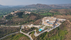 birdeye view of Fateh Vilas surrounded by green mountains