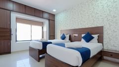 Spacious bedroom with two single beds and a contemporary design- Magnus Aerith Studio, Kharadi