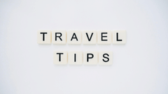 Travel Tips made out of scrabble tiles and placed on a table