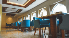 An image of seating area with sofa sets and a centre table placed in a room -  The Garden Ananta Elite, Rajkot