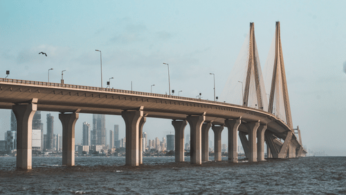 An overview of the sealink bridge in Mumbai from afar with the Arabian sea in view as well.