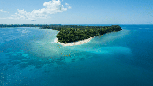 Far out view of the Neil Island of Andaman and Nicobar Islands nestled amidst vast blue sea.