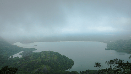 An aerial view of Aliyar dam with a waterbody in view - tourist places near coimbatore 