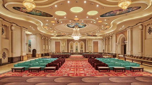 chandeliers hanging above sofas set up for an event in our banquet hall in Pilibhit - Royal Kingdom Sarovar Portico, Pilibhit