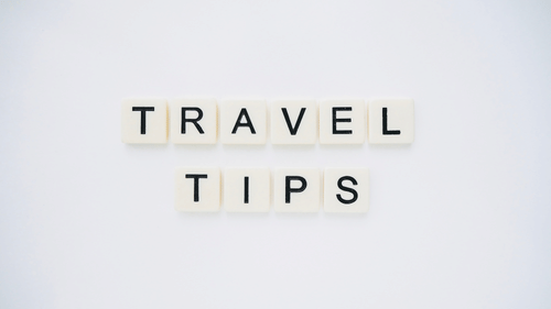 travel tips made out from scrabble tiles and places on a table.