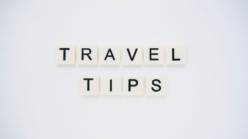 travel tips made out from scrabble tiles and places on a table
