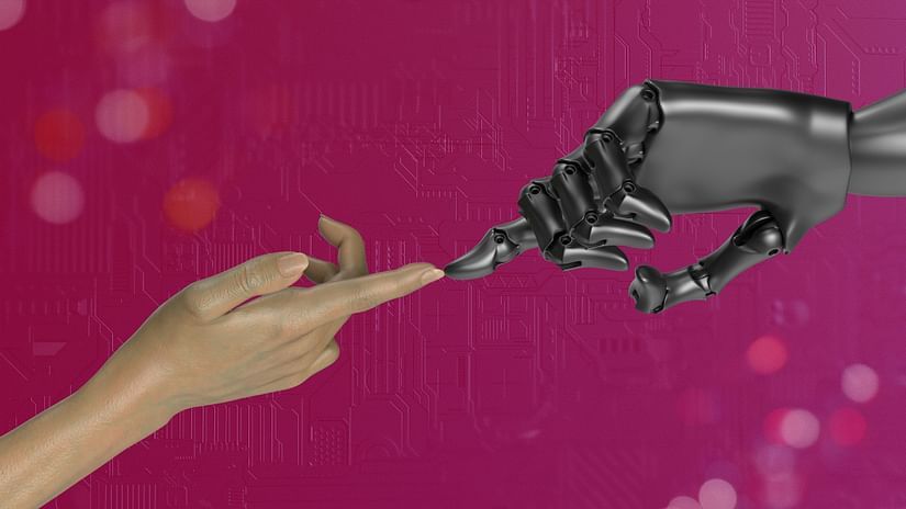 A human hand and a robotic hand touching to show technology helping humans - Automation Companies in Mumbai.