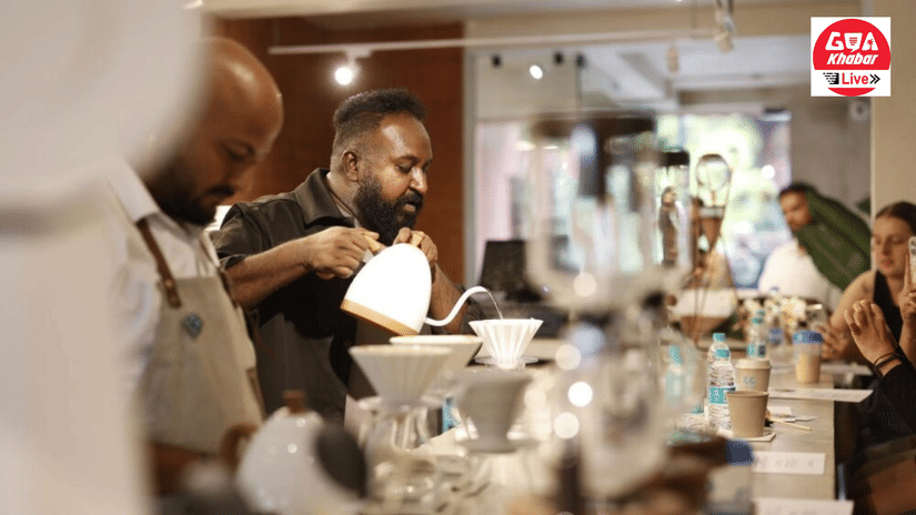 A barista in a dark outfit carefully pouring hot water over a coffee dripper at Unseen Boutique Hotel Assagao Goa with multiple brewing setups and guests visible in the background.
