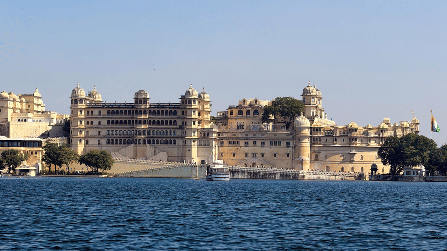 A wide view of City palace, Udaipur, on the blue water of lake pichola.