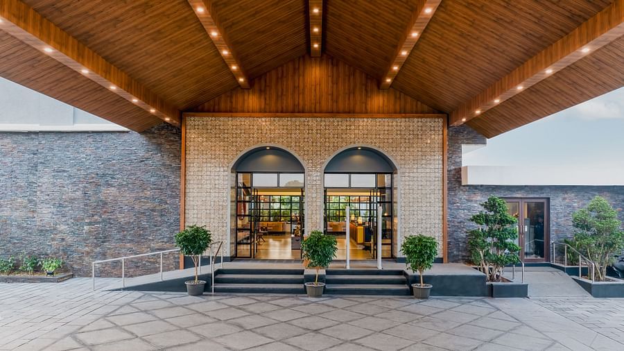 exterior image of Cloud9 Sarovar Premiere Palolem Goa with wooden finished ceiling illuminating yellow lights