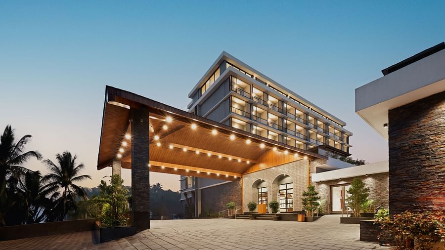 facade image of Cloud9 Sarovar Premiere, Palolem Goa illuminating yellow lights in the evening.