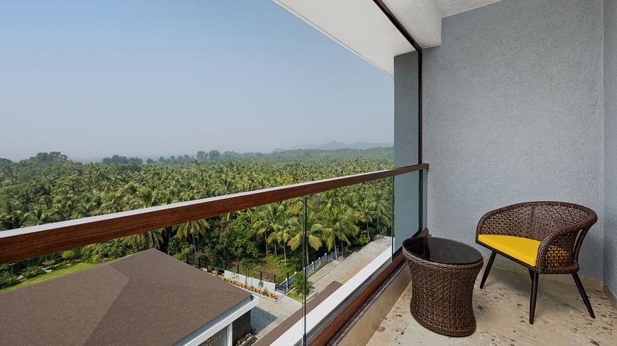 an image of a balcony with greenery view at Cloud9 Sarovar Premiere, Palolem Goa