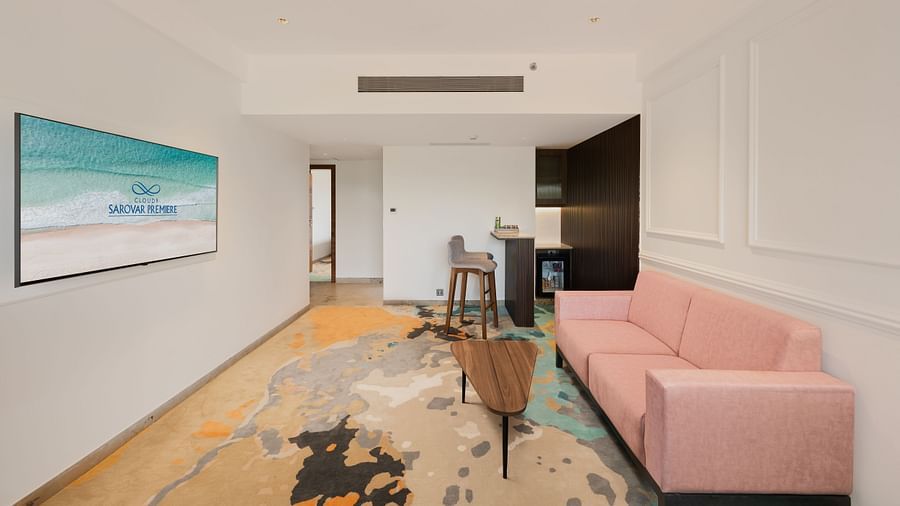 an image of living space of suit with a wall mounted television at Cloud9 Sarovar Premiere, Palolem Goa