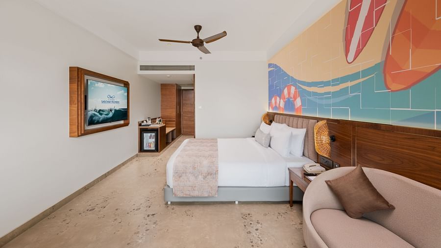 an image of side view of a bedroom with a fan hanging from the ceiling at Cloud9 Sarovar Premiere, Palolem Goa