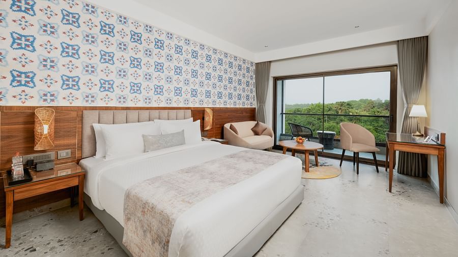 an image of a bedroom featuring a balcony with valley view at Cloud9 Sarovar Premiere, Palolem Goa