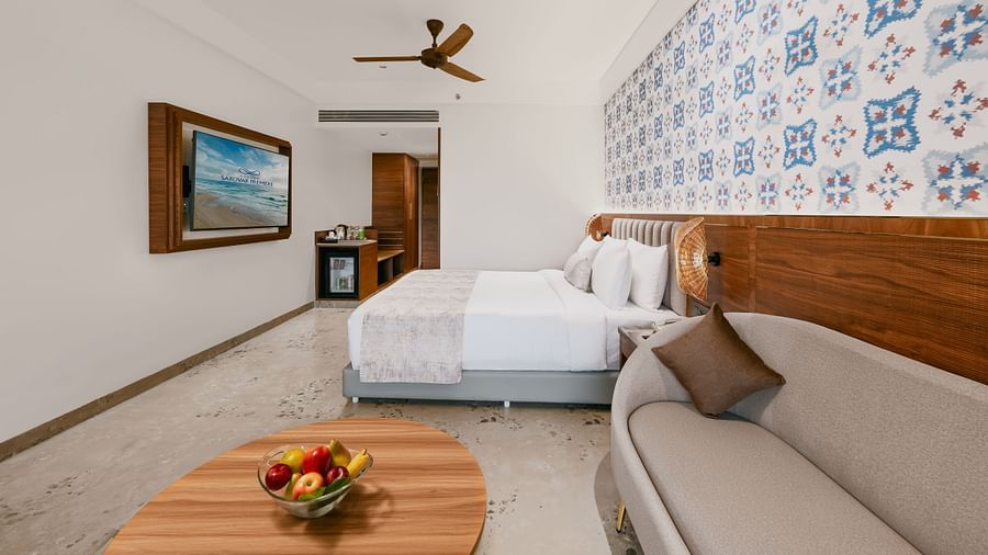 Side view of a bedroom featuring a sofa with a pillow placed on it at Cloud9 Sarovar Premiere, Palolem Goa
