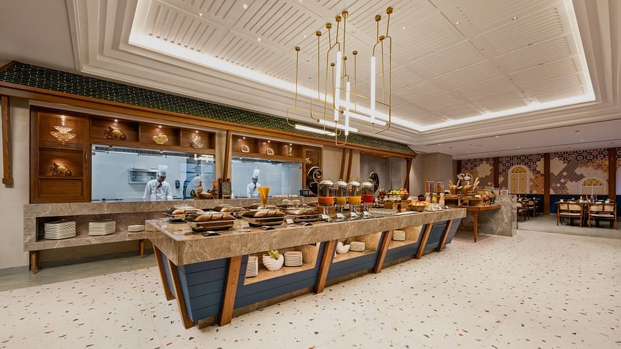 an image of a dining space with fancy lights hanging from the ceiling at Cloud9 Sarovar Premiere, Palolem Goa