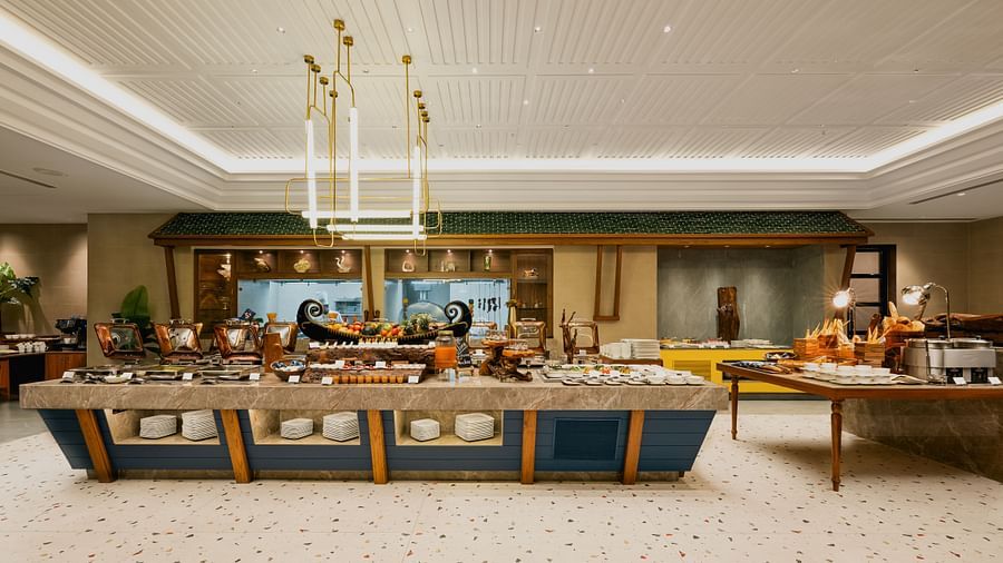 Buffet dining space with a variety of fruits and foods laid out on the table at Cloud9 Sarovar Premiere, Palolem Goa