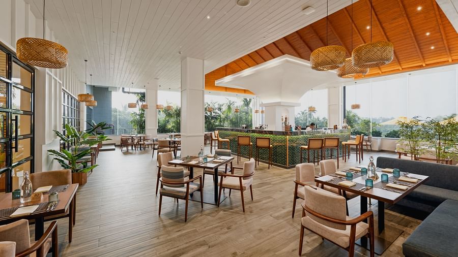 an image of rooftop restaurant with patterned wooden finished ceiling in the centre at Cloud9 Sarovar Premiere, Palolem Goa 
