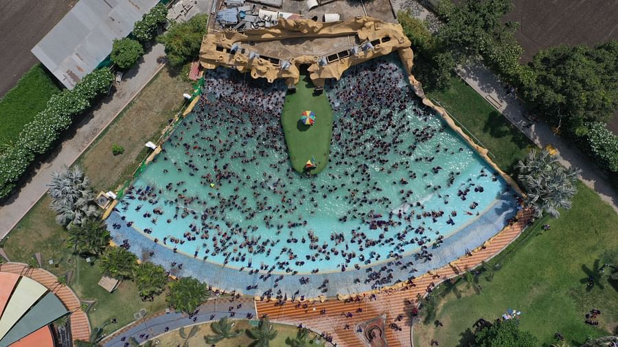An aerial view of people enjoying in the pool