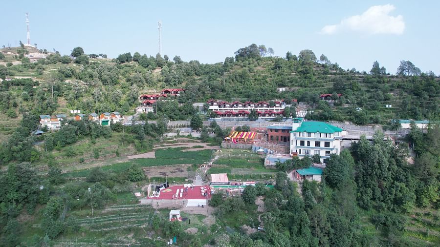 A distant view capturing a building and an outdoor wedding venue